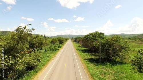 AERIAL: truck overtaking another truck before a motorbike in Peru near Tarapoto. Tarapoto,  photo