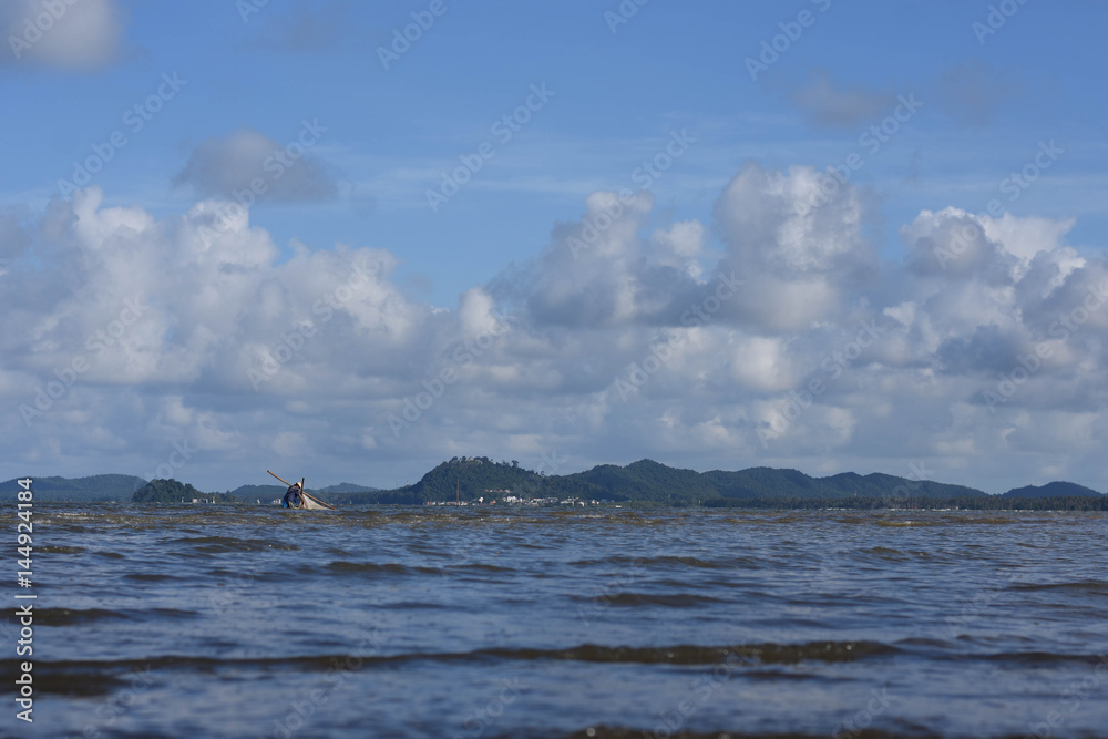 A man is fishing in the Gulf of Thailand