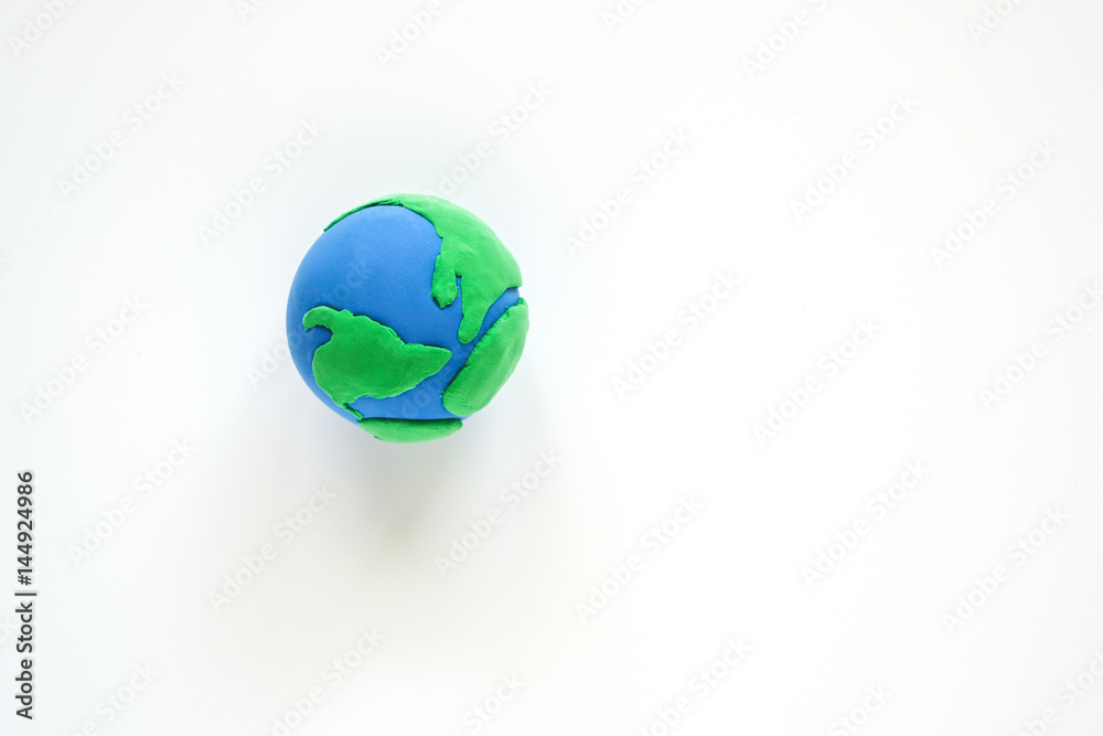 Globe ,earth made from clay on white background. Concept Save green planet. Earth day holiday concept