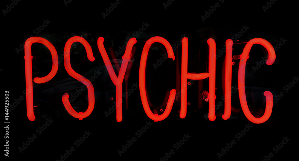 Psychic red neon light sign glowing at night. Psychic red neon light sign glowing at night.