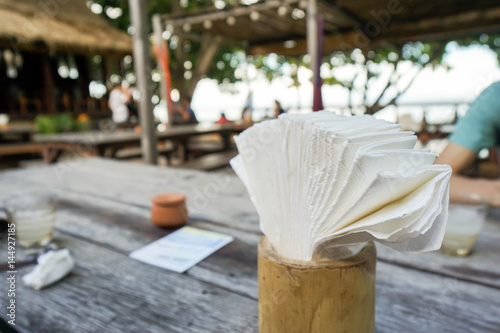 napkin paper in bamboo wood box on dining table
