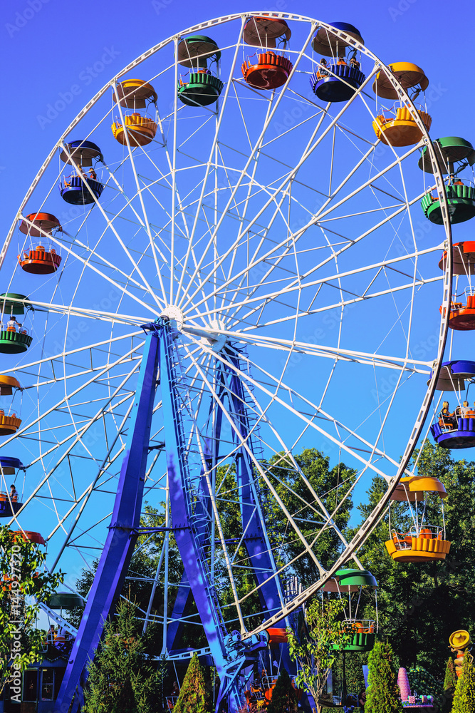 Attraction the Ferris wheel in the Park. Attraction the Ferris wheel in the Park.