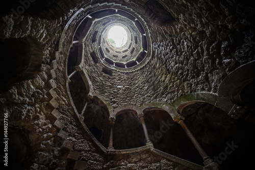 The Initiation well of Quinta da Regaleira in Sintra. The depth of the well is 27 meters. It connects with other tunnels through underground passages. Sintra. Portugal photo