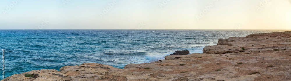 View on Mediterranean Sea from high rock bank at sunset. Cape Greko, Cyprus.
View on Mediterranean Sea from high rock bank at sunset. Cape Greko, Cyprus.
