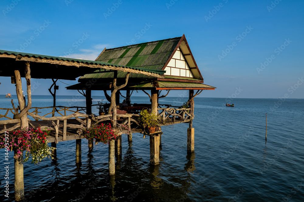 pavilion and wood bridge in the sea