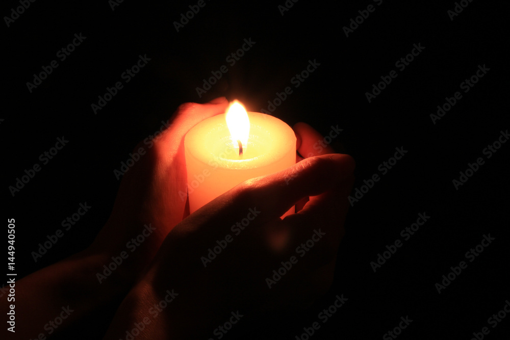 Candle in hands Candle in hands