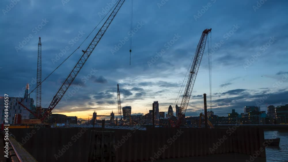Sunset in London at Bermondsey. City is under construction. blue sky, blue clouds. Building London. Sunset in London at Bermondsey. City is under construction. blue sky, blue clouds. Building London.