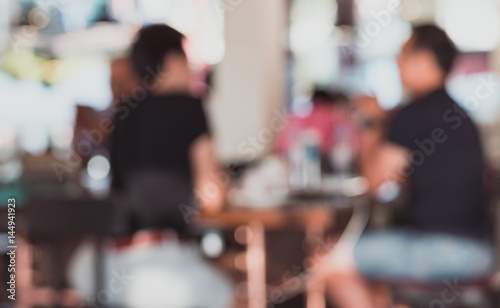 Blur image of a crowd of people at coffee shop,vintage tone © Hide_Studio