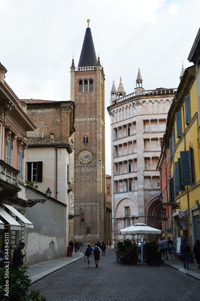 Cathedral Tower and Baptistery from Duomo Street in Parma city. Construction of Baptistery began in 1196 by Antelami.