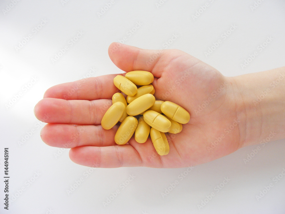 many tablets in hand /children hand and pills many tablets in hand /children hand and pills