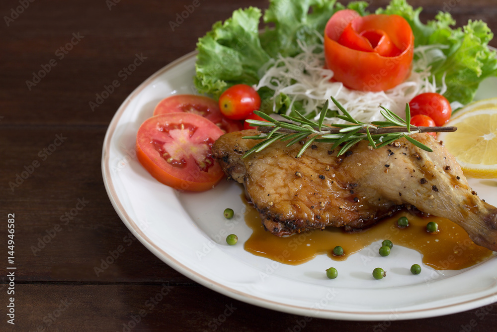 Grilled Chicken steak with black pepper and teriyaki sauce In white dish and vegetables in the basket on the wooden table Grilled Chicken steak with black pepper and teriyaki sauce In white dish and vegetables in the basket on the wooden table
