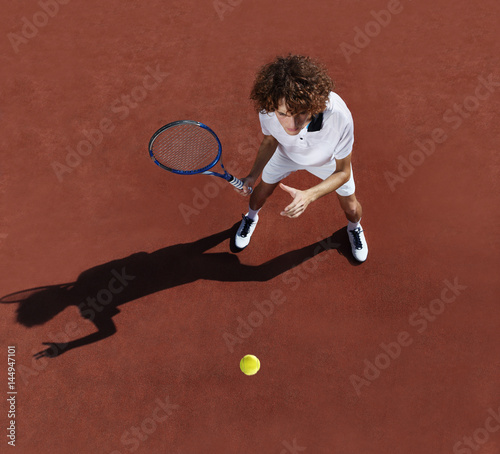 tennis player with racket during a match game © amedeoemaja