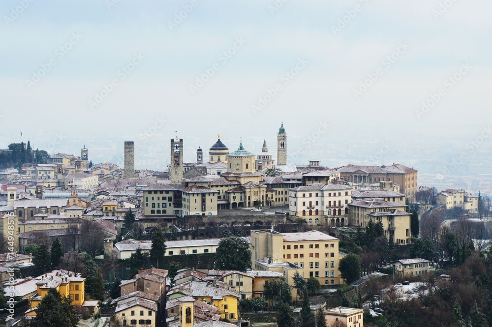 Amazing view of Bergamo city with snow on the old upper city, Italy