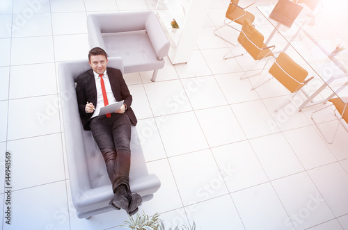 Portrait of a mature business man while relaxing photo