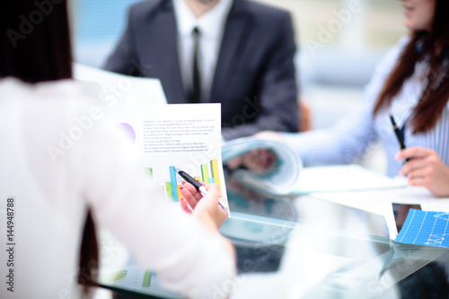 Business people Having Meeting Around Table In Modern Office photo