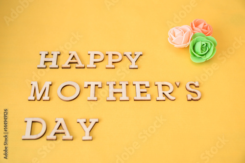 happy mother's day text, yellow background © cristina87