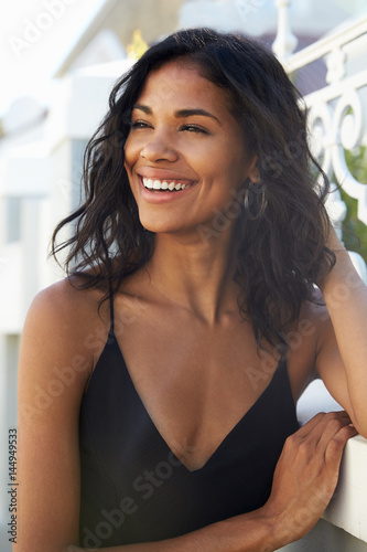 Young Latin American woman outdoors looking away smiling Free Download Young Latin American woman outdoors looking away smiling - GFXLoad