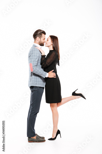 Happy young loving couple hugging isolated