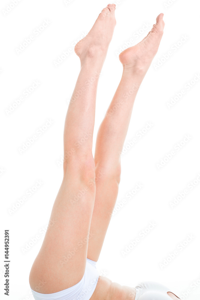 Long pretty woman legs, isolated on white. Beautiful female legs after depilation. Long pretty woman legs, isolated on white. Beautiful female legs after depilation.