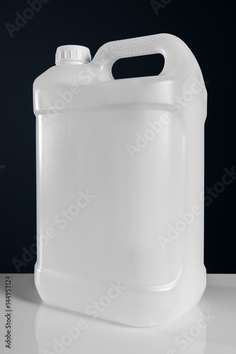 Unlabeled white plastic tank canister chemical liquid container