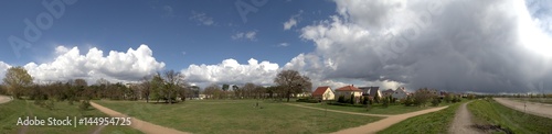 Panorama of a city park with suburban houses