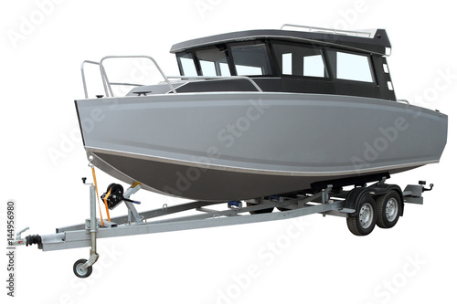Modern cabin boat on the trailer for transportation.