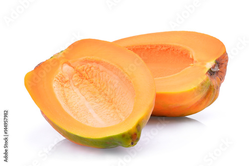 half of fresh papaya seedless isolated on white background