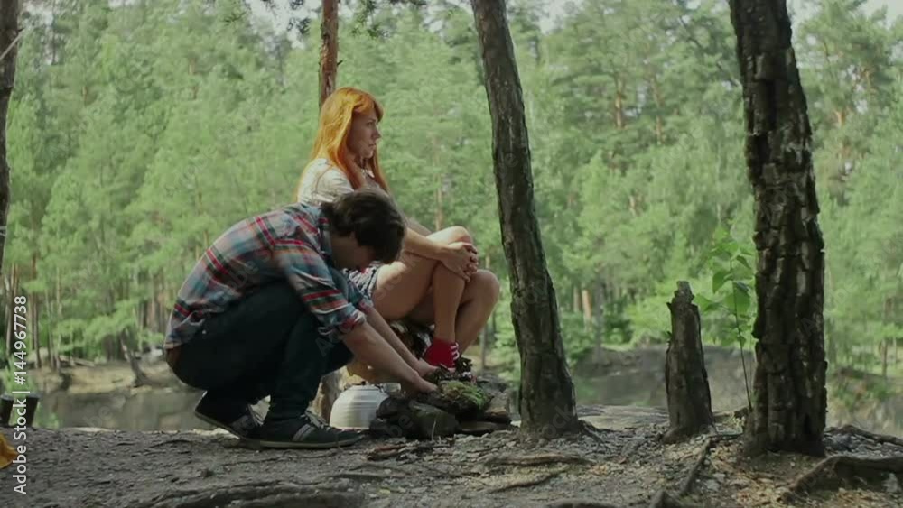 Happy couple has a good time at camping trip. Happy couple has a good time at camping trip.