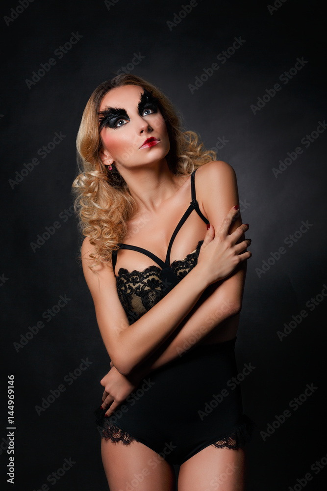 Fashion model in black underwear with art make-up