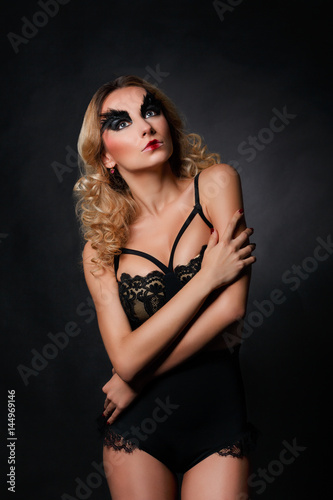 Fashion model in black underwear with art make-up