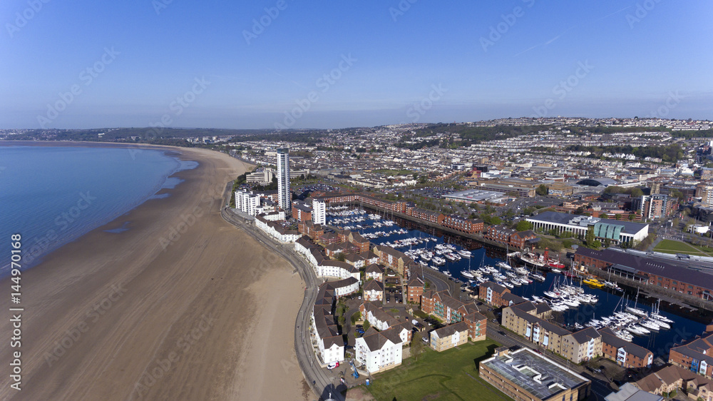 Editorial SWANSEA, UK - APRIL 19, 2017: An aerial view of the Swansea City showing the marina, coastal housing, Leisure centre, Swansea market, County Hall and Meridian Tower.
