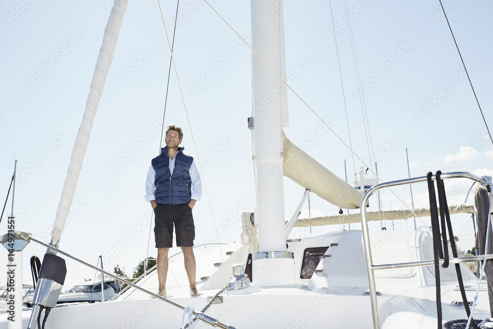 Mature man on his sailing boat Mature man on his sailing boat