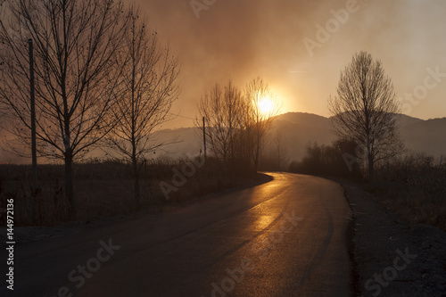 Sunset on a road in the hills of Satu Mare county Romania