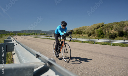 cyclist training on a lonely road