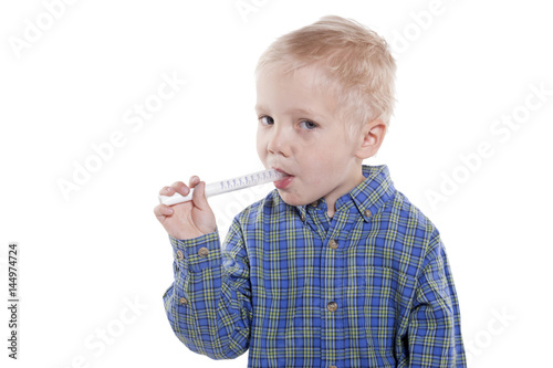 child taking medicine