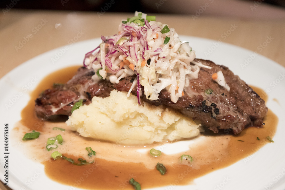 delicious steaks on mashed potato delicious steaks on mashed potato