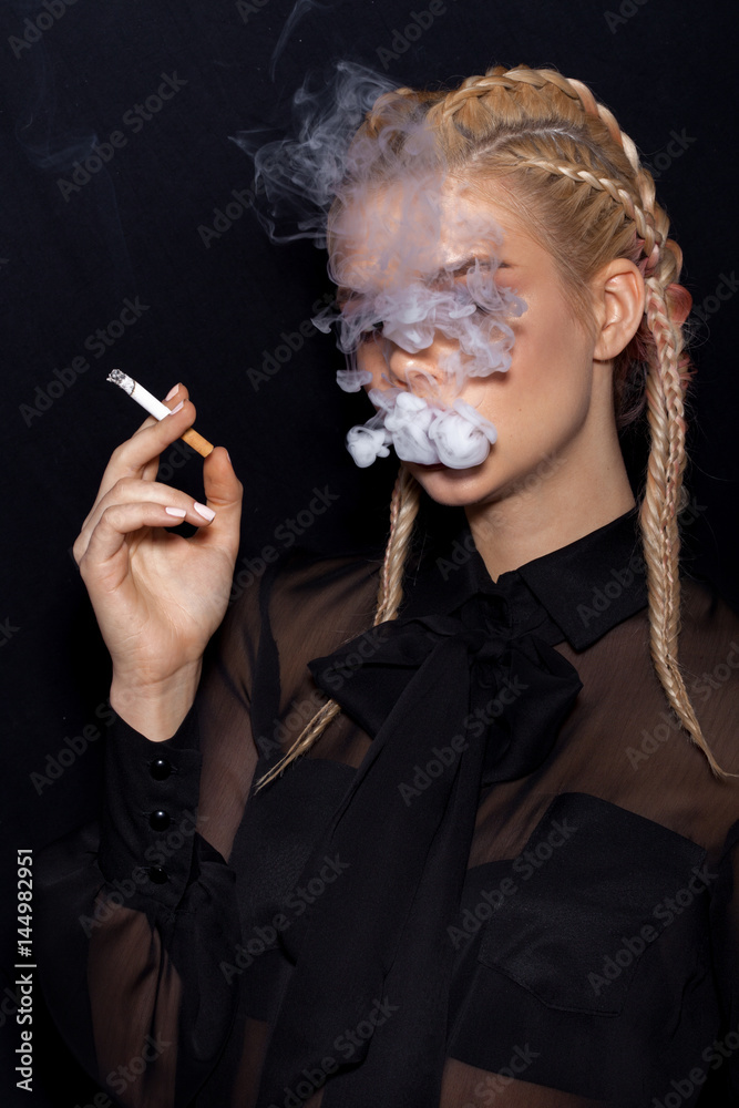 Fototapeta premium Beautiful Woman smoking cigarette