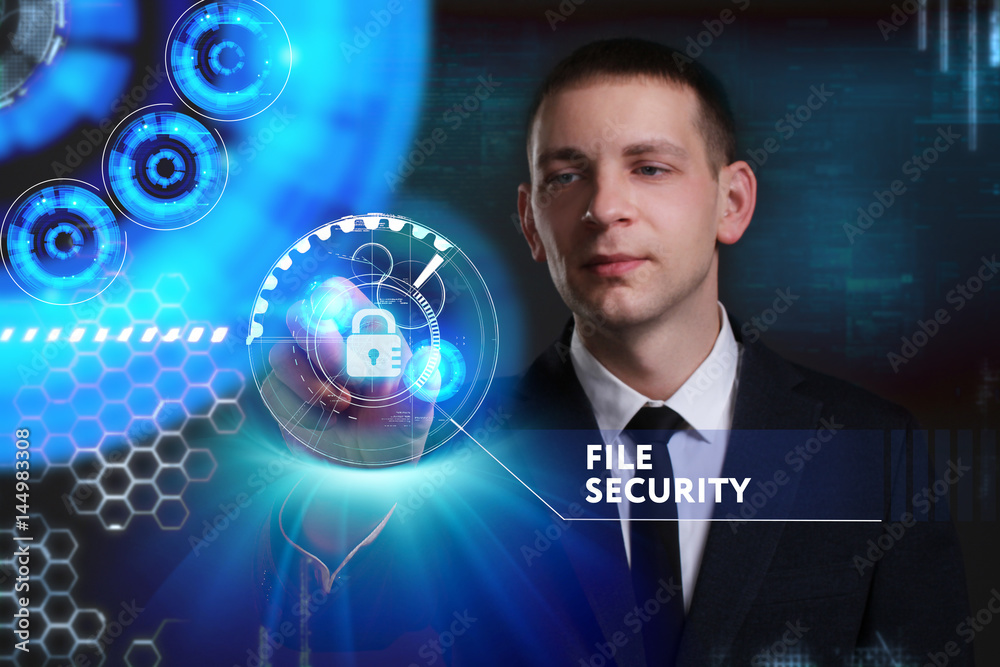 Business, Technology, Internet and network concept. Young businessman working on a virtual screen of the future and sees the inscription: File security Business, Technology, Internet and network concept. Young businessman working on a virtual screen of the future and sees the inscription: File security