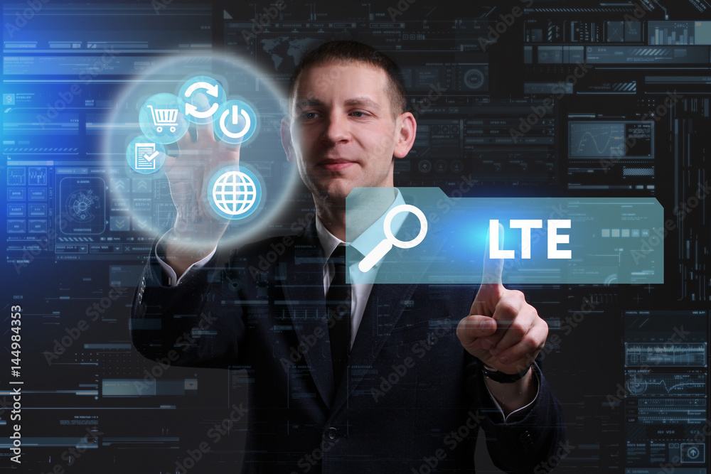 Business, Technology, Internet and network concept. Young businessman working on a virtual screen of the future and sees the inscription: LTE Business, Technology, Internet and network concept. Young businessman working on a virtual screen of the future and sees the inscription: LTE