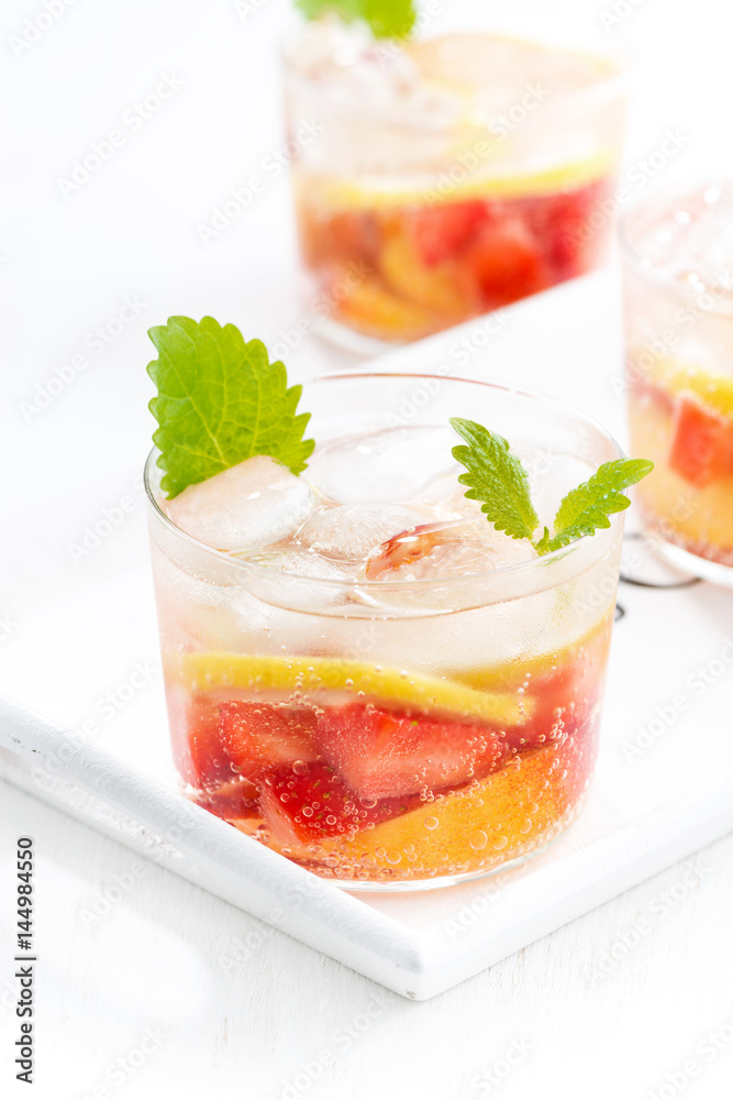 lemonade with strawberry and lemon on white tray, vertical lemonade with strawberry and lemon on white tray, vertical