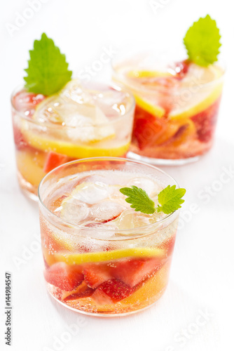 lemonade with strawberry and lemon on a white background
