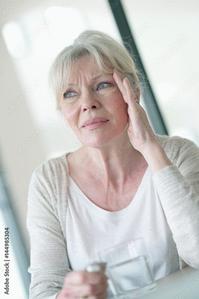 Senior woman suffering migraine Senior woman suffering migraine