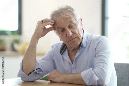 Portrait of senior man showing sadness