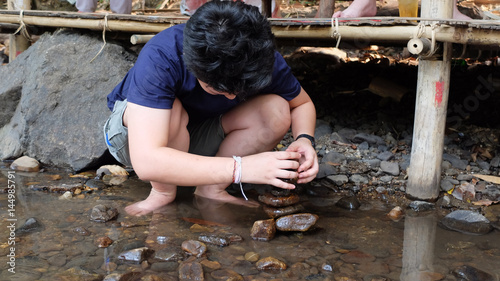 young man sort stone