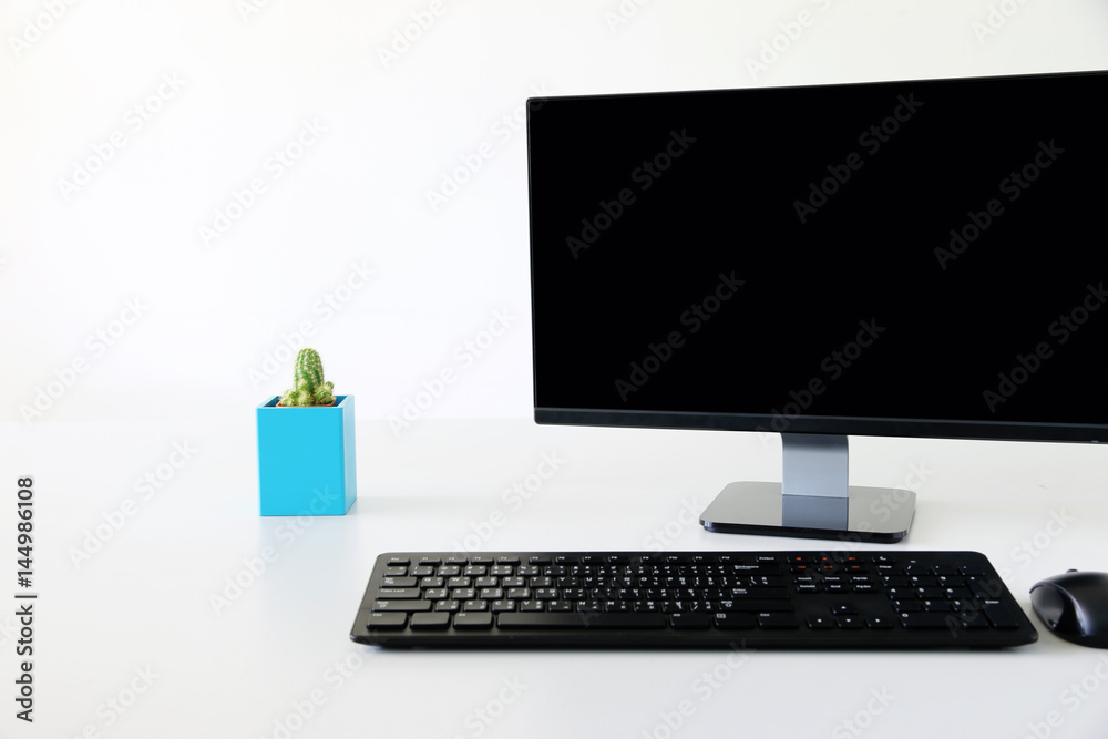 Computer monitor on the table ,background white Office.copy space. Computer monitor on the table ,background white Office.copy space.