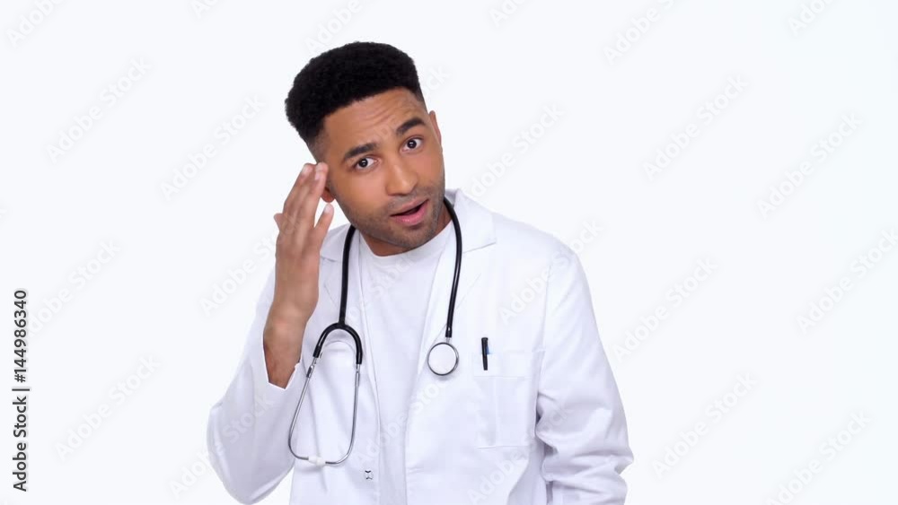 Young doctor wearing lab coat surprising isolated Young doctor wearing lab coat surprising isolated