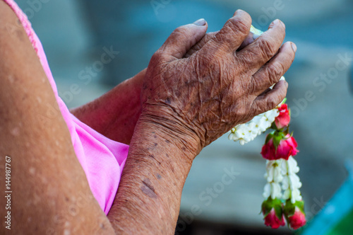 Thai Songkran festival,  elder hand with jasmin garland