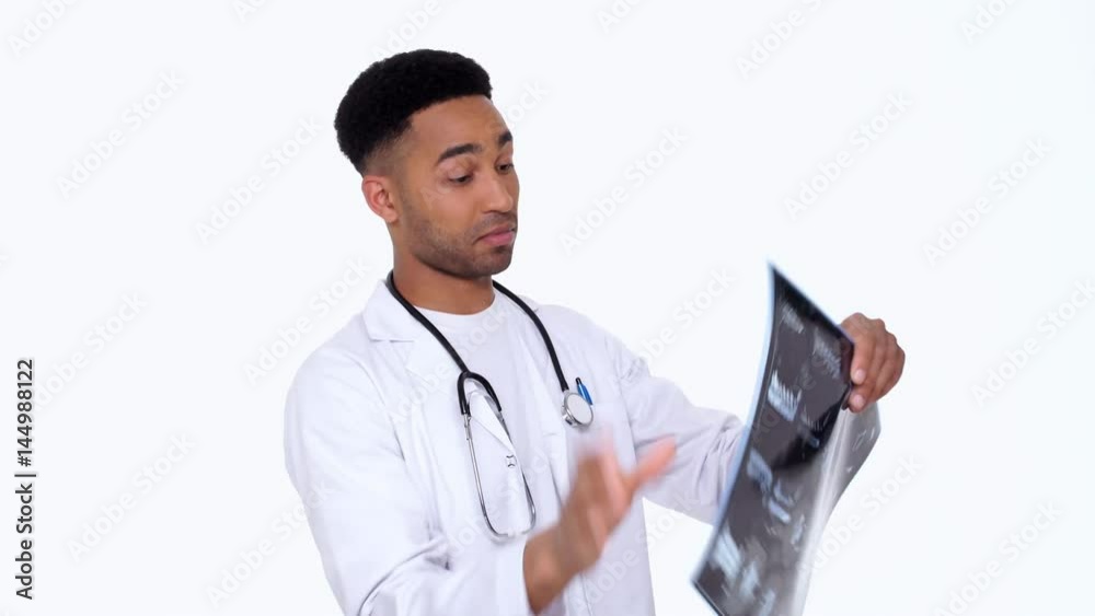 Man doctor trying to understand x-ray image isolated Man doctor trying to understand x-ray image isolated