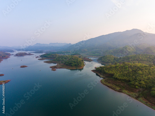 Aerial view of small islands in a lake at morning light