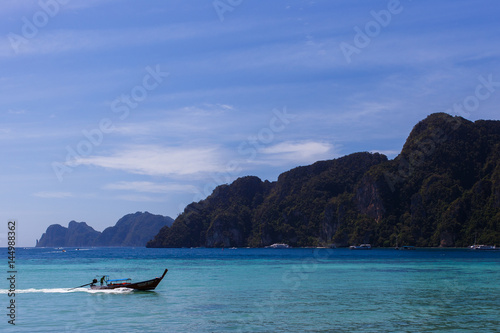 Sea coast with floating boat